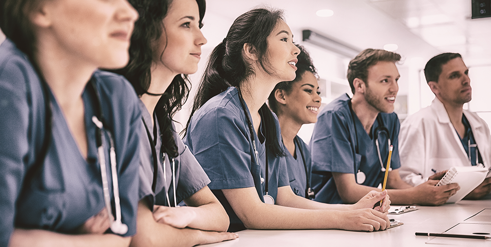 Young doctors sitting and smiling